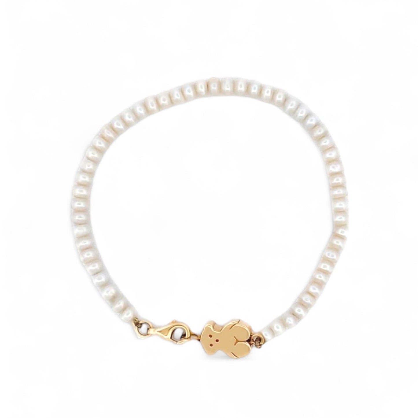 Comprar pulsera original de la firma TOUS con perlas cultivadas y oso sweet dolls en oro amarillo de 18kt. Pieza descatalogada. Pulseras Tous baratas. Ian'Or.