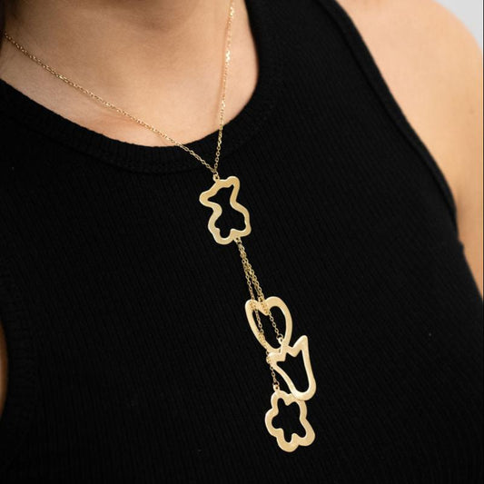 Collar original de la firma Tous de oro de 18kt con cadena de 40cm de largo y colgantes en forma de osito, corazón, tulipán y flor en oro. Con cierre tipo reasa.
Joyería compro oro, dónde comprar y vender joyas en Barcelona al mejor precio. Venta de joyas. Joyas de segunda mano Tous.