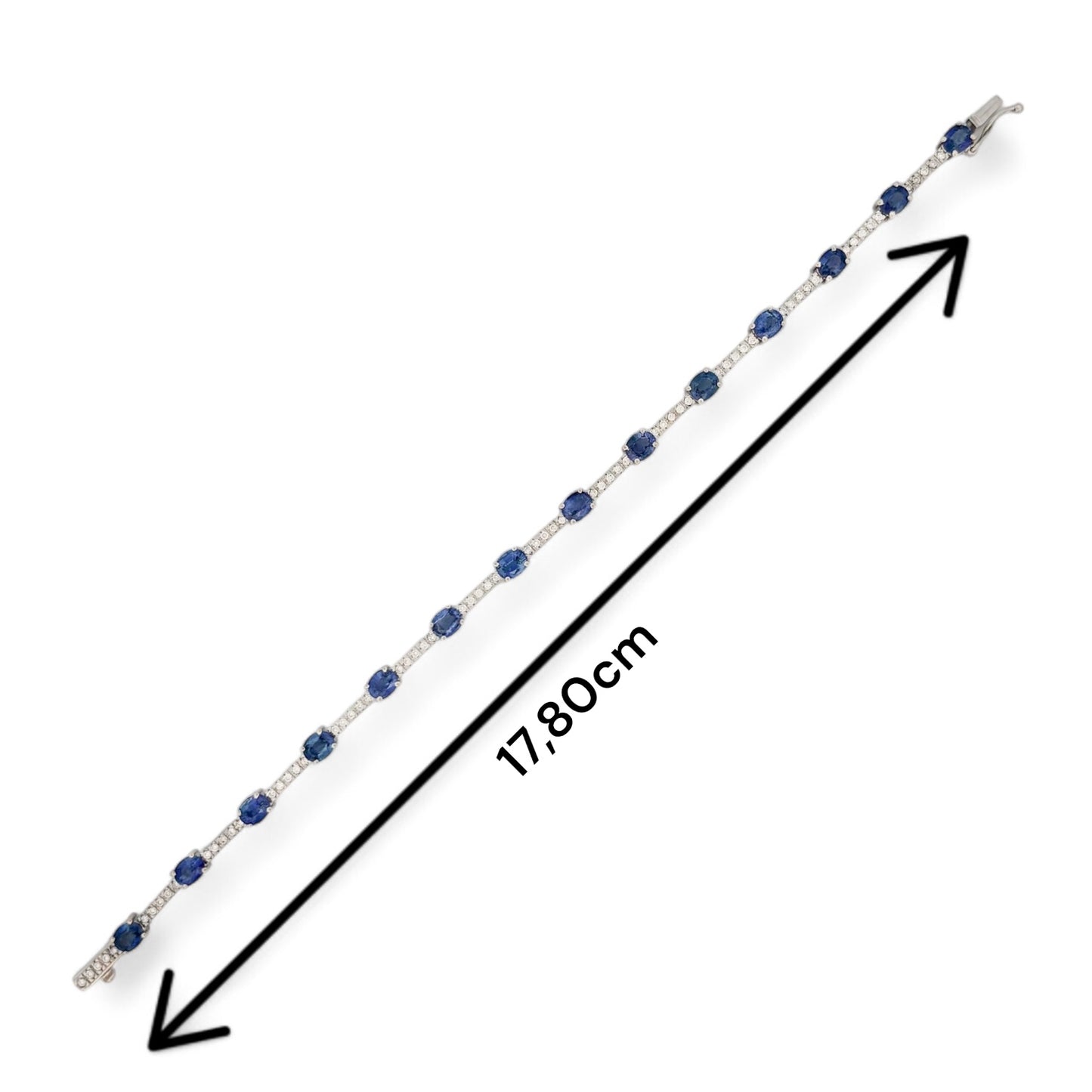 Pulsera riviere de oro blanco de 18kt con 70 diamantes talla brillante y 14 zafiros talla oval intercalados. Esta preciosa pulsera dispone de cierre cajón y cierre lateral de seguridad. 