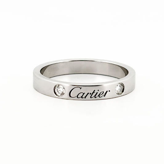 Comprar alianza de la prestigiosa firma Cartier realizada en platino y con dos diamantes talla brillante engastados. Cartier de segunda mano. Joyería Ian'Or.
