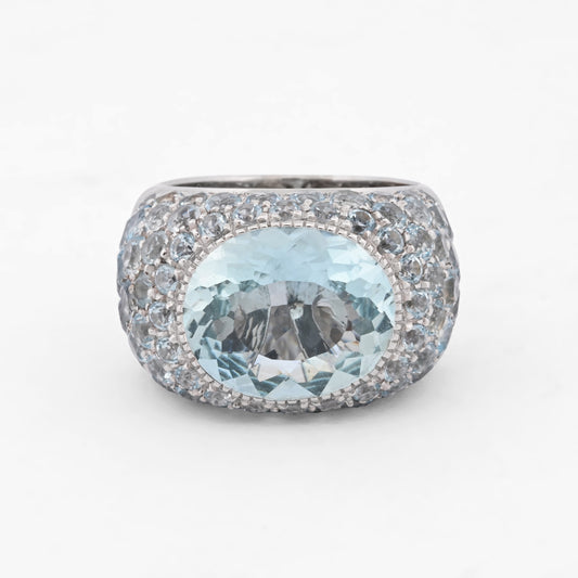Comprar anillo de la firma Sillam realizado en oro blanco de 18kt con aguamarina central y talla brillante alrededor y en los brazos del anillo. Envío GRATIS.