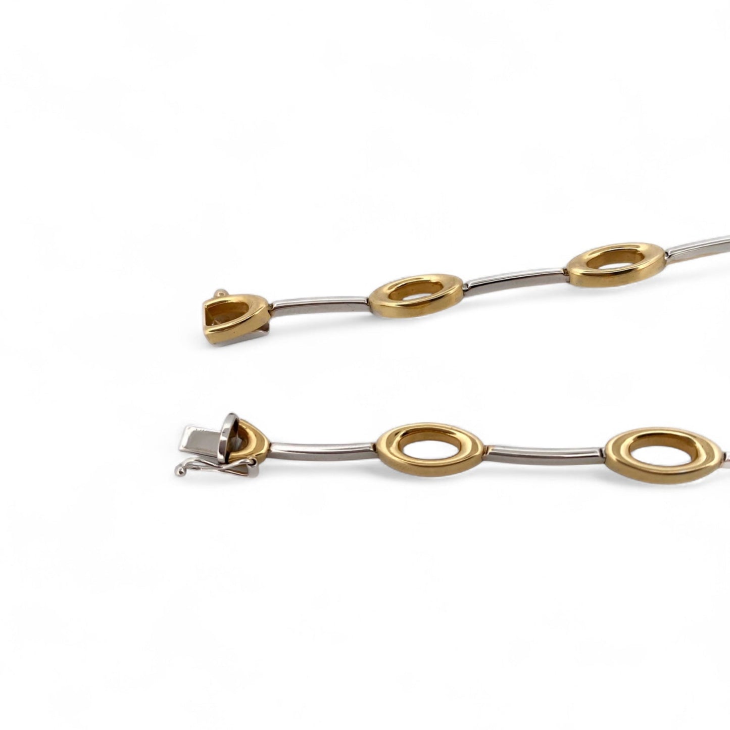 Comprar collar semirrígido realizado en oro blanco y amarillo de 18kt. Cierre de cajón y un brazo de seguridad. Joyería Compro Oro Barcelona. Ian'Or.