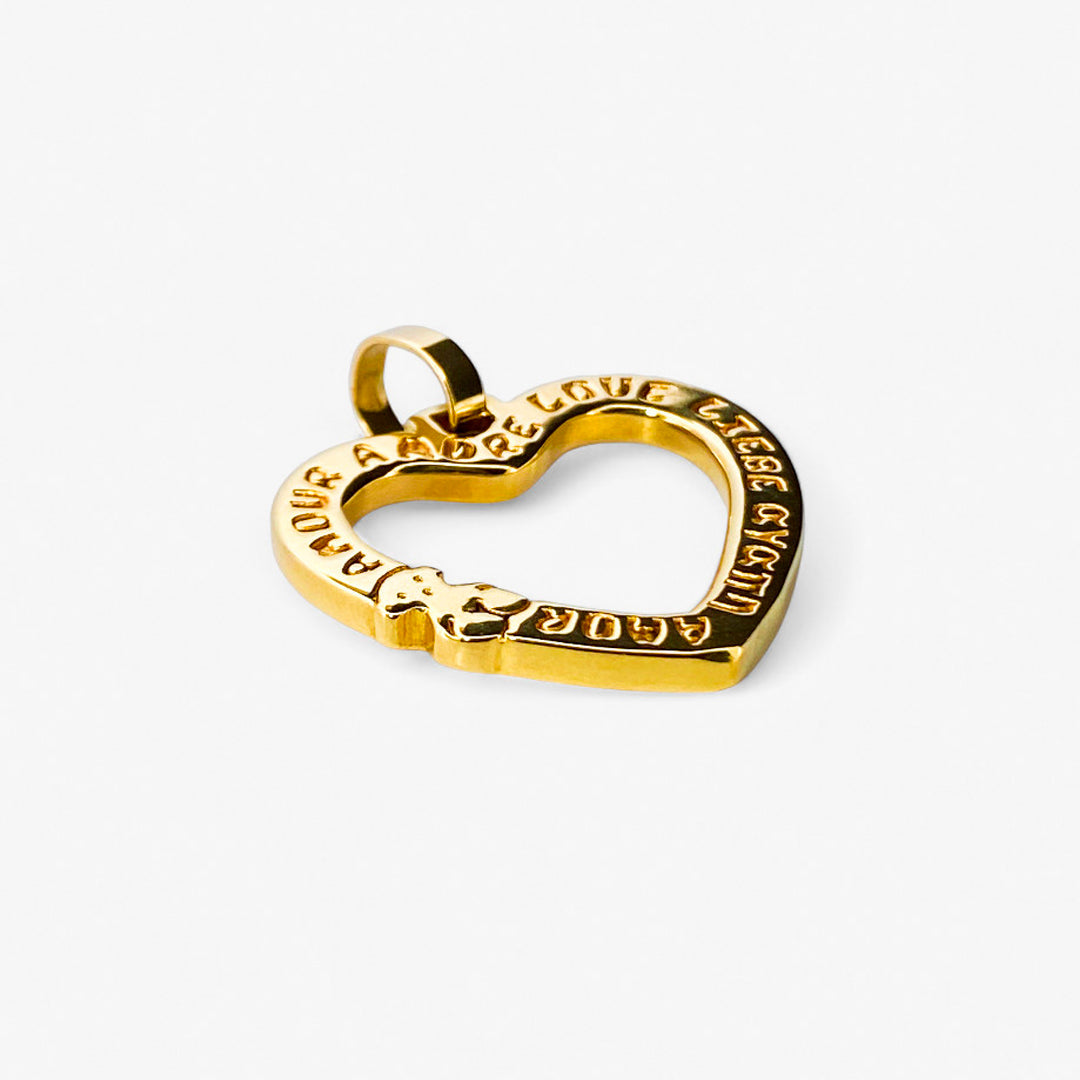 Comprar Colgante TOUS en forma de corazón realizado en oro amarillo de 18kt. Congrabado del icónico osito de la marc y la palabra Amor. Venta de joyas Tous segunda mano