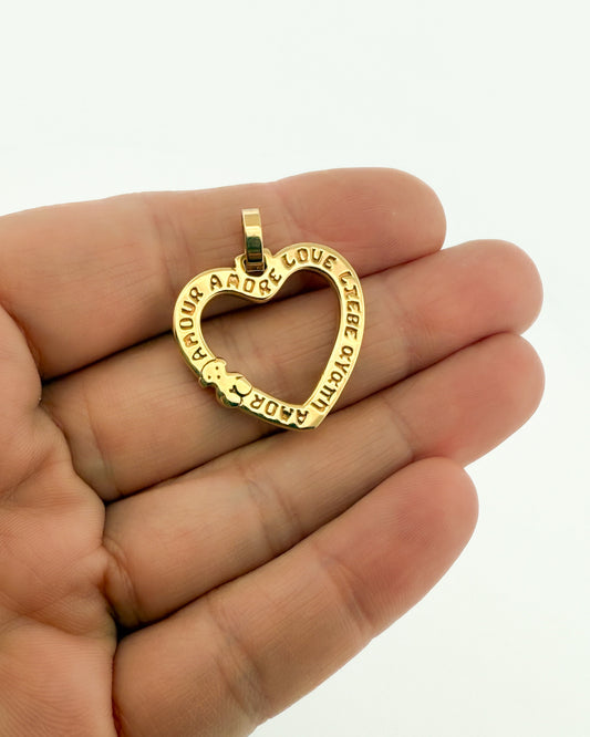 Comprar Colgante TOUS en forma de corazón realizado en oro amarillo de 18kt. Congrabado del icónico osito de la marc y la palabra Amor. Venta de joyas Tous segunda mano