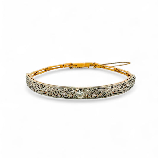 Comprar pulsera semirrígida Art Deco realizada en oro blanco de 18kt y platino con diamante central y diamantes talla antigua a lo largo de la pulsera. Ian'Or.