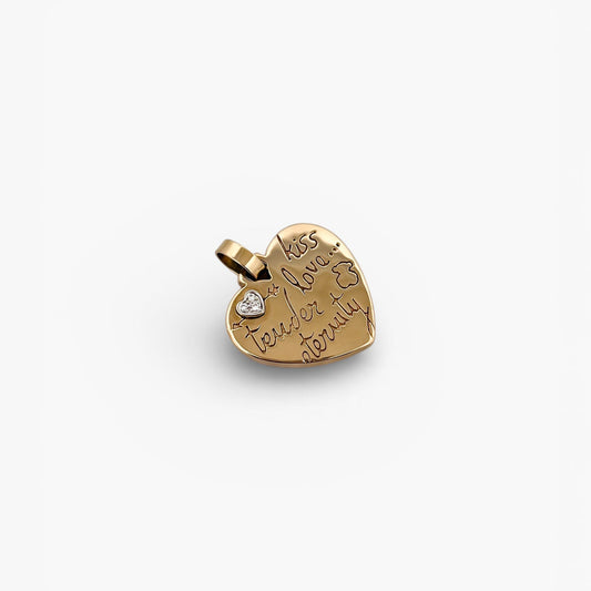 Comprar colgante de la firma TOUS en forma de corazón realizado en oro amarillo de 18kt con un pequeño corazón de diamante en la esquina.Tous en oro amarillo de 18kt. Venta de joyas Tous segunda mano. Ian'Or.