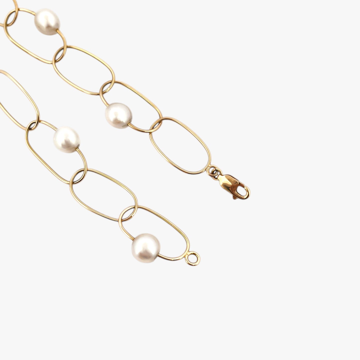 comprar pulsera de Oro amarillo de 18kt con seis perlas y cierre tipo mosquetón. La pulsera mide 22,5cm de largo.