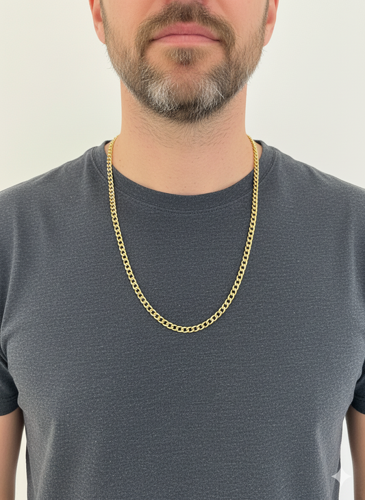 Collar de oro amarillo de 18kt con cadena barbada tipo cubana plana y cierre tipo mosquetón. Joya unisex. Joyería Ian'Or. Envío GRATIS.