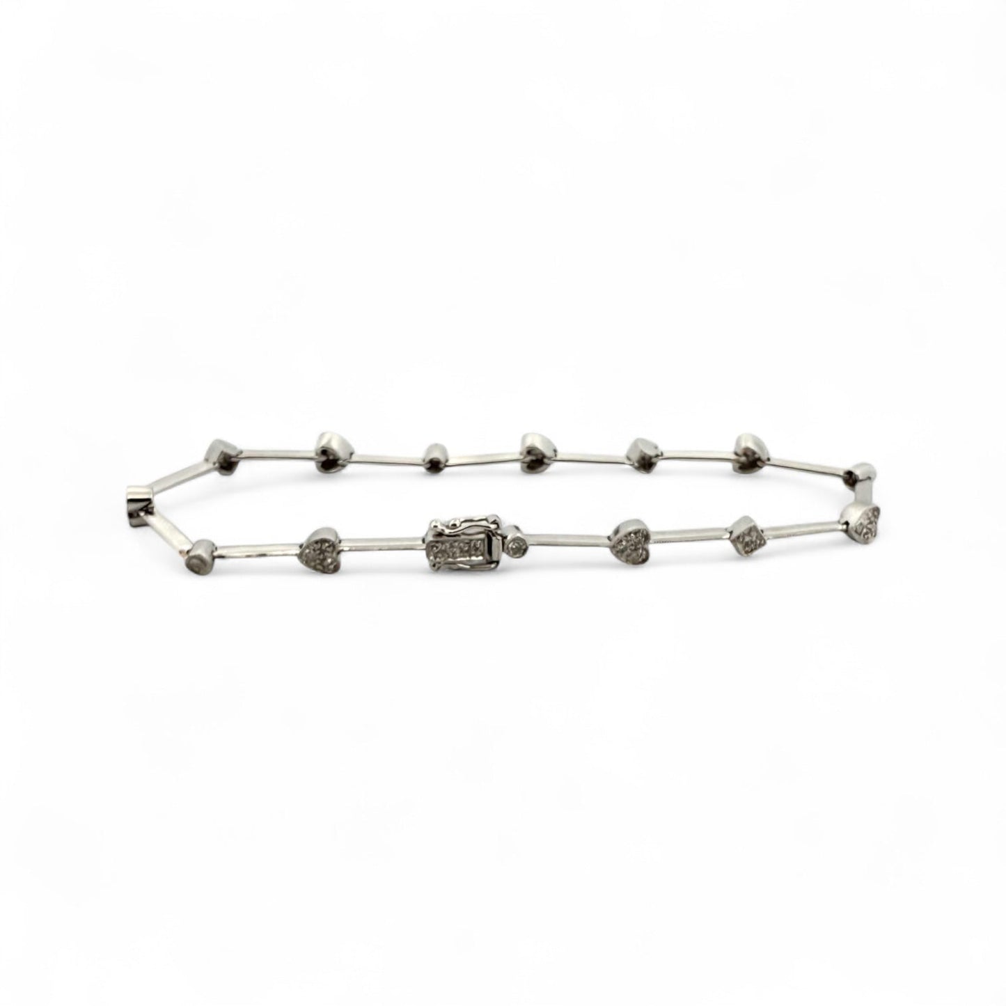 Comprar pulsera semirrígida realizada en oro blanco de 18kt con motivos de corazón, circulo y cuadrado y diamantes talla brillante. Joyas de segunda mano.