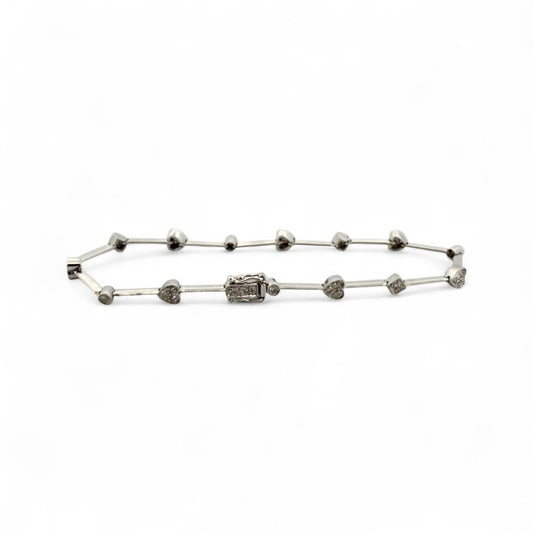 Comprar pulsera semirrígida realizada en oro blanco de 18kt con motivos de corazón, circulo y cuadrado y diamantes talla brillante. Joyas de segunda mano.