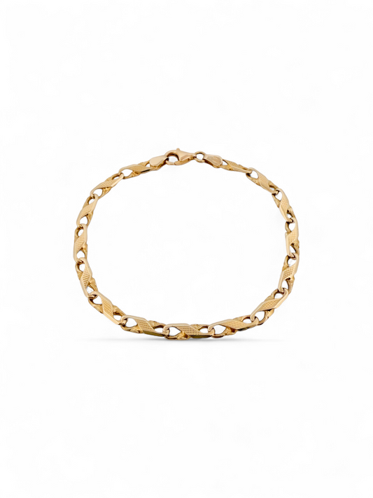 Pulsera oro amarillo de 18kt con eslabones en forma de infinito. Cierre tipo mosquetón.. Comprar pulseras de oro al mejor precio en Barcelona