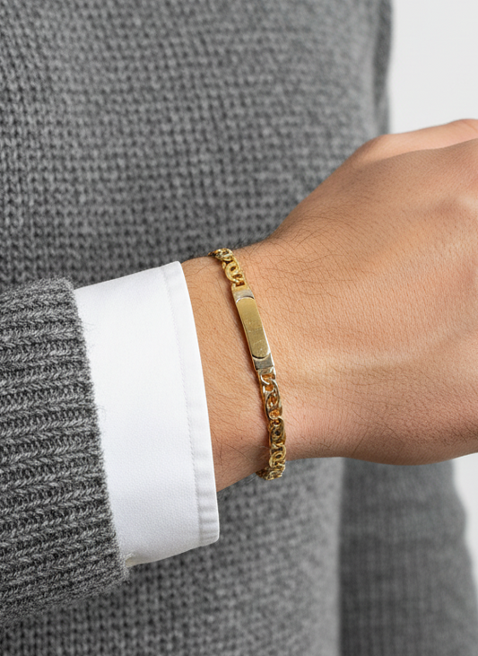 Comprar pulsera no me olvides realizada oro amarillo de 18kt con cadena tipo ojo de lince y una placa. Esta pulsera dispone de cierre tipo mosquetón.Esclavas de oro 18kt baratas.