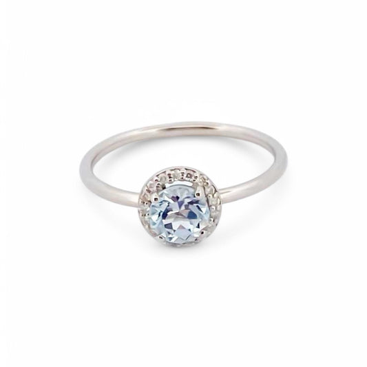 Comprar anillo en oro blanco de 18kt de la firma Tous con un Topacio central y rosetón de diamantes talla brillante alrededor. Joyas Tous baratas. Joyas restauradas.