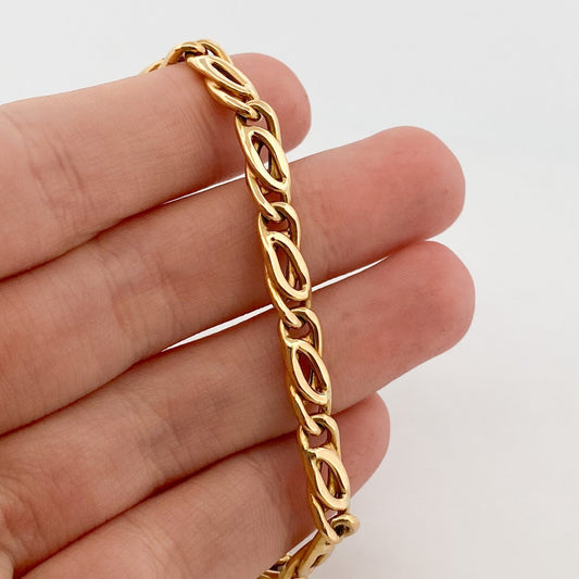 Comprar cadena realizada en oro amarillo de 18kt con eslabones ojo de tigre y cierre tipo mosquetón. Joyas restauradas. Cadenas de oro de 18kt. Joyería Ian'Or.