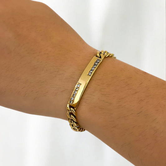 Comprar pulsera oro amarillo de 18kt con cadena tipo cubana y una placa central con diamantes. Joyas al mejor precio en Barcelona. Ian'Or.
