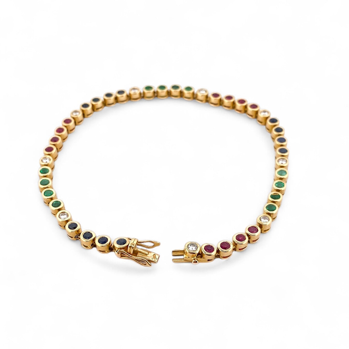 Pulsera semirígida de oro de 18kt con 3 rubíes, 3 esmeraldas y 30 zafiros azules talla princesa. Joyería Ian'Or. Joyas segunda vida. Envío GRATIS.