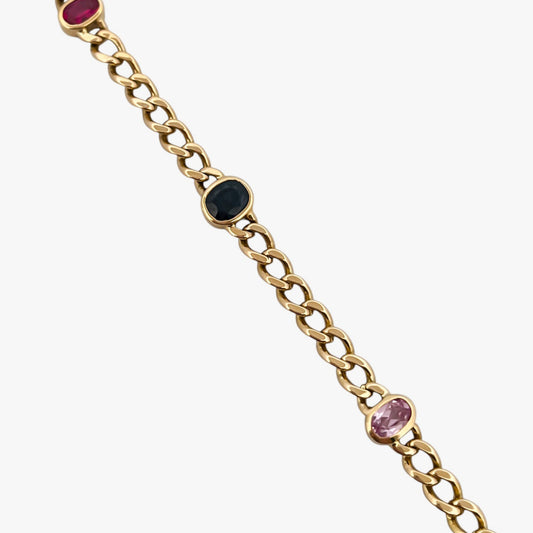 Comprar pulsera realizada oro amarillo de 18kt con cadena tipo barbada cubana y tiene 2 zafiros rosas, 1 zafiro azul y 1 topacio rosa, intercalados. Esta pulsera dispone de cierre tipo cajon con doble brazo de seguridad. Pulseras de oro 18kt baratas