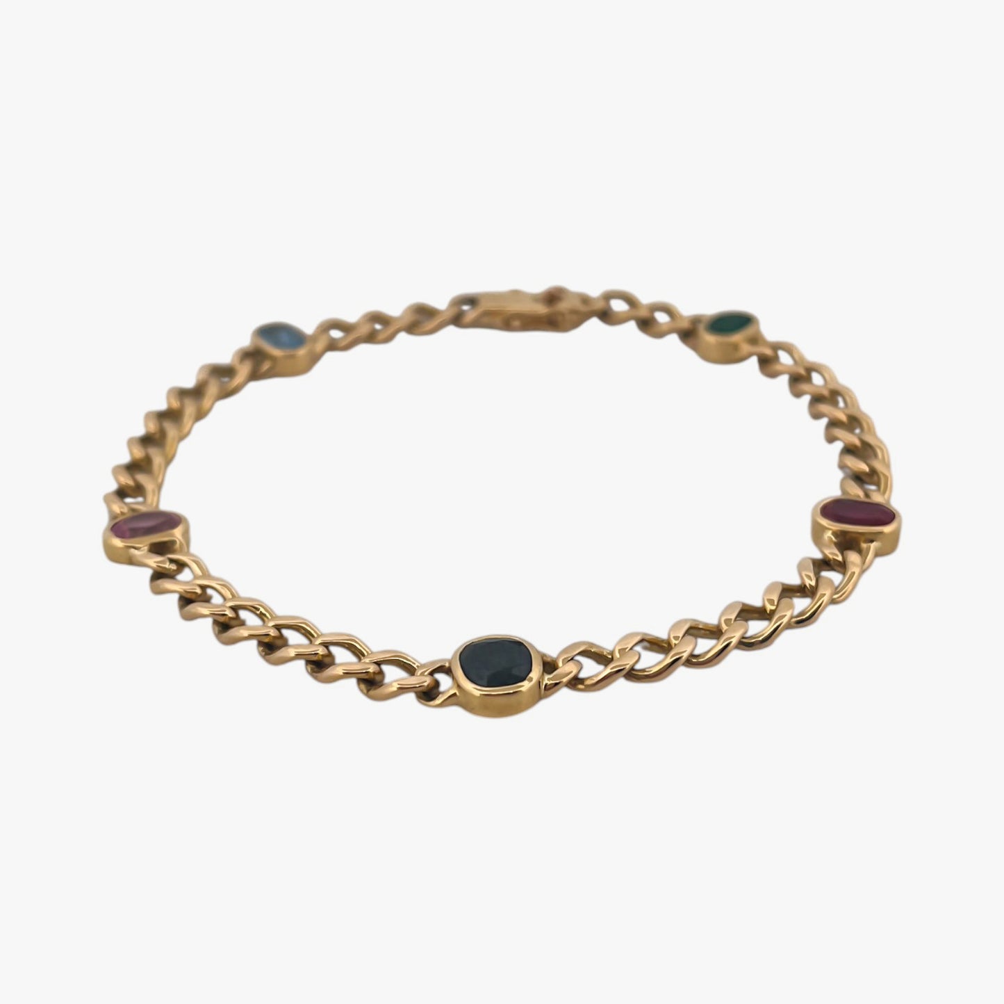 Comprar pulsera realizada oro amarillo de 18kt con cadena tipo barbada cubana y tiene 2 zafiros rosas, 1 zafiro azul y 1 topacio rosa, intercalados. Esta pulsera dispone de cierre tipo cajon con doble brazo de seguridad. Pulseras de oro 18kt baratas
