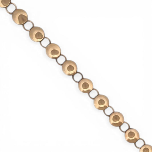 Comprar pulsera oro amarillo de 18kt con cadena de eslabones de bolitas planas. La pulsera mide 20,5cm y hace 7,77mm de grosor. Esta pulsera dispone de cierre tipo mosquetón.