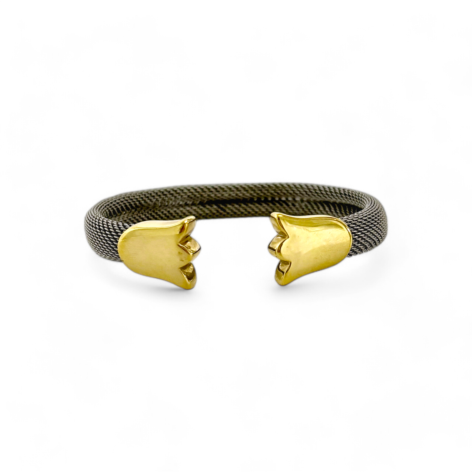 Esta icónica pulsera de Tous está realizada en acero y oro amarillo de 18k. La esclava está realizada con el tejido característico de malla en acero y los detalles de tulipán en oro amarillo de 18k.  Joyería compro oro Barcelona donde comprar y vender oro al mejor precio