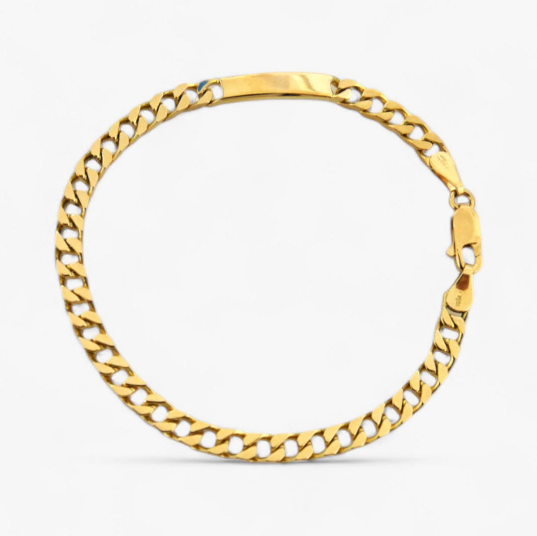 Pulsera oro de 18kt con cadena tipo cubana de oro de 18kt con una placa situada en un lateral que lo convierte en un no me olvides sofisticado. La cadena mide 19cm y tiene 4mm de grosor. Joyería Ian'or, dónde comprar y vender oro al mejor precio en Barcelona. Joyas de segunda mano y restauradas en Barcelona.