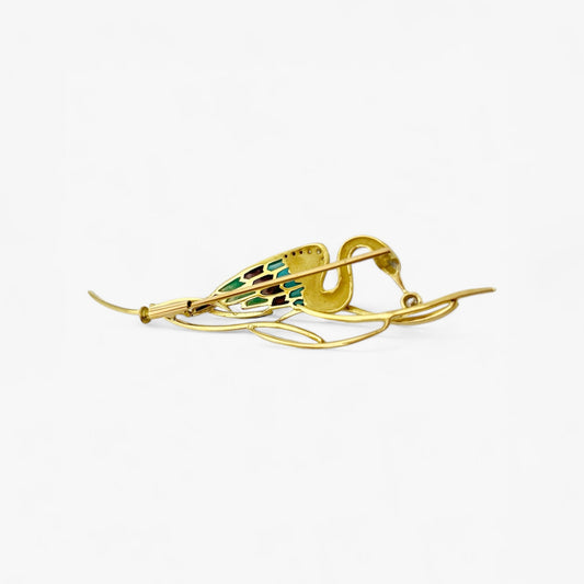 Broche realizado en oro amarillo de 18kt con un cisne que sujeta un diamante talla brillante. Joyas antiguas y vintage en Barcelona, envio gratis
