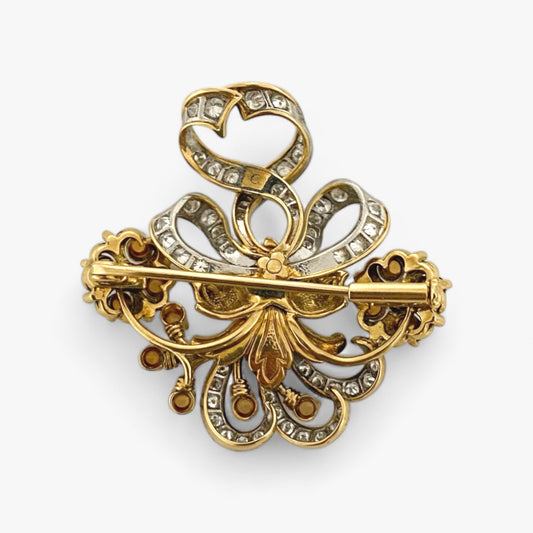Comprar broche estilo vintage con motivos florales realizado en Oro de 18kt con 52 diamantes talla Brillante engastados en oro blanco y detalles en ámbar.