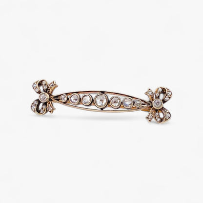 Comprar broche con lazos realizado en oro amarillo de 18kt y platino con 9 diamantes talla brillante. Joyas vintage en Barcelona, envio gratis pieza certidicada