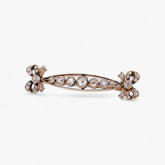 Comprar broche con lazos realizado en oro amarillo de 18kt y platino con 9 diamantes talla brillante. Joyas vintage en Barcelona, envio gratis pieza certidicada