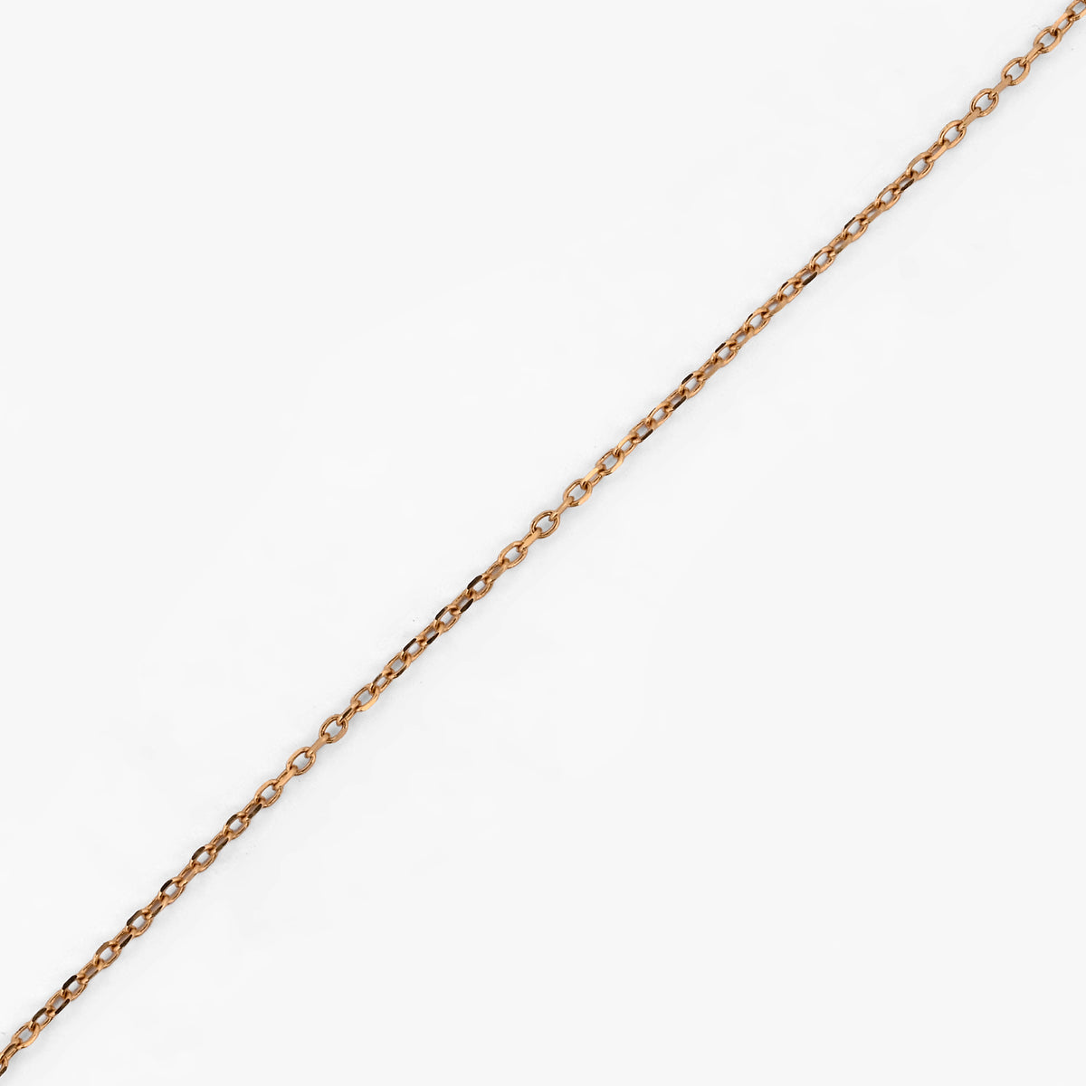 Collar original de la firma Tous de oro de 18kt con cadena de 40cm de largo y colgantes en forma de osito, corazón, tulipán y flor en oro. Con cierre tipo reasa.