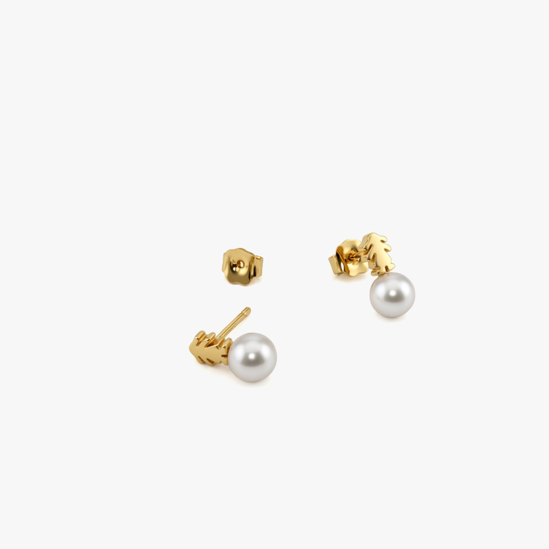 Comprar pendientes originales de la firma TOUS realizados en oro amarillo de 18kt con niñas encima de perlas cultivadas. Con cierre por presión. Joyería Ian'Or.