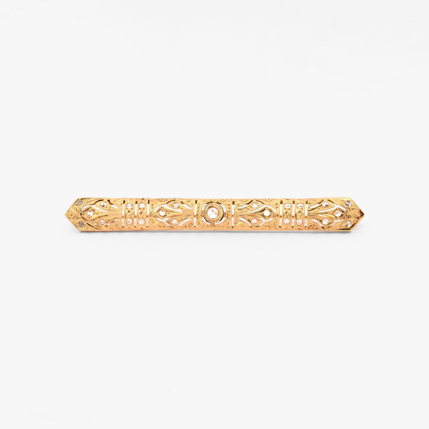 Broche vintage art decó tipo alfiler realizado en Oro amarillo de 18kt con pequeños&nbsp; diamantes talla antigua y un diamante central de 2,5mm.  Broches de oro vintage para novias.