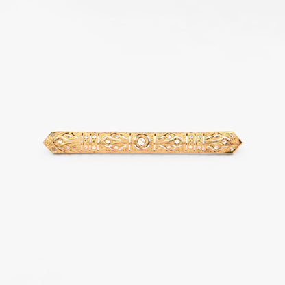 Broche vintage art decó tipo alfiler realizado en Oro amarillo de 18kt con pequeños&nbsp; diamantes talla antigua y un diamante central de 2,5mm.  Broches de oro vintage para novias.