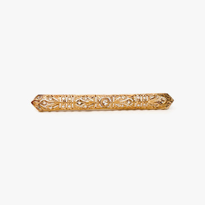 Broche vintage art decó tipo alfiler realizado en Oro amarillo de 18kt con pequeños&nbsp; diamantes talla antigua y un diamante central de 2,5mm.  Broches de oro vintage para novias.