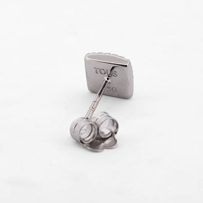 Comprar pendientes realizados en oro blanco de 18kt originales de la firma TOUS con ónix guardado y diamantes talla brillante alrededor. Joyas Tous restauradas.