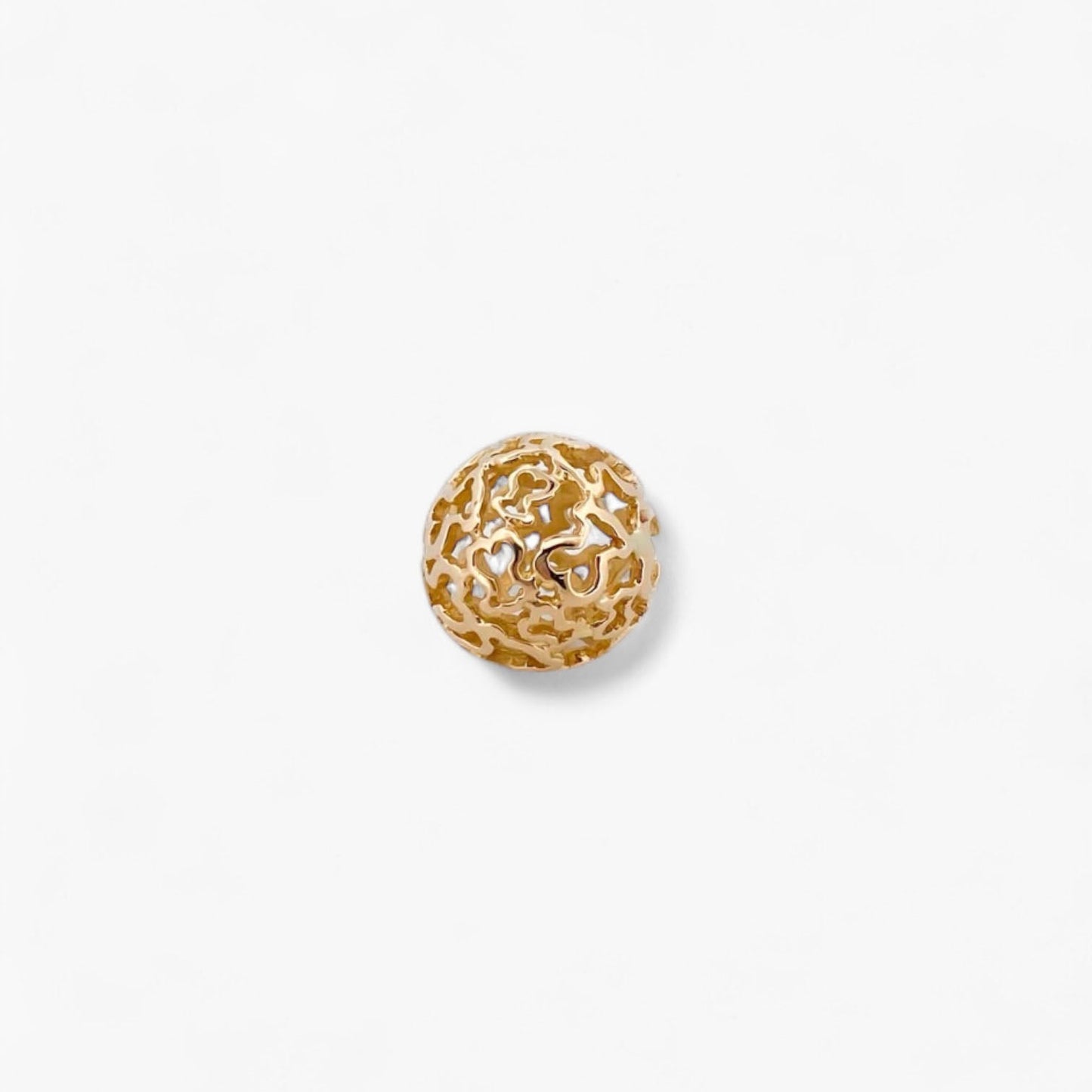 Comprar colgante en forma de bola hueca con la silueta de los icónicos ositos de la firma Tous en oro amarillo de 18kt. Venta de joyas Tous segunda mano.