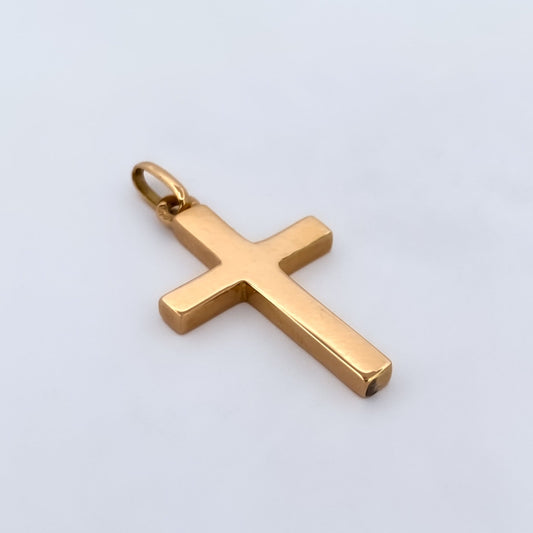 Comprar colgante en oro amarillo de 18kt en forma de cruz y acabado liso. Joyería Ian'Or. Joyas de segunda mano. Joyas con motivos religiosos. Envío GRATIS.