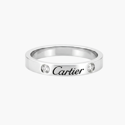 Comprar alianza de la prestigiosa firma Cartier realizada en platino y con dos diamantes talla brillante engastados. Cartier de segunda mano. Joyería Ian'Or.