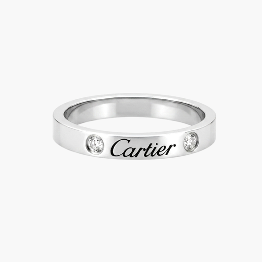 Comprar alianza de la prestigiosa firma Cartier realizada en platino y con dos diamantes talla brillante engastados. Cartier de segunda mano. Joyería Ian'Or.