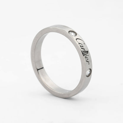 Comprar alianza de la prestigiosa firma Cartier realizada en platino y con dos diamantes talla brillante engastados. Cartier de segunda mano. Joyería Ian'Or.