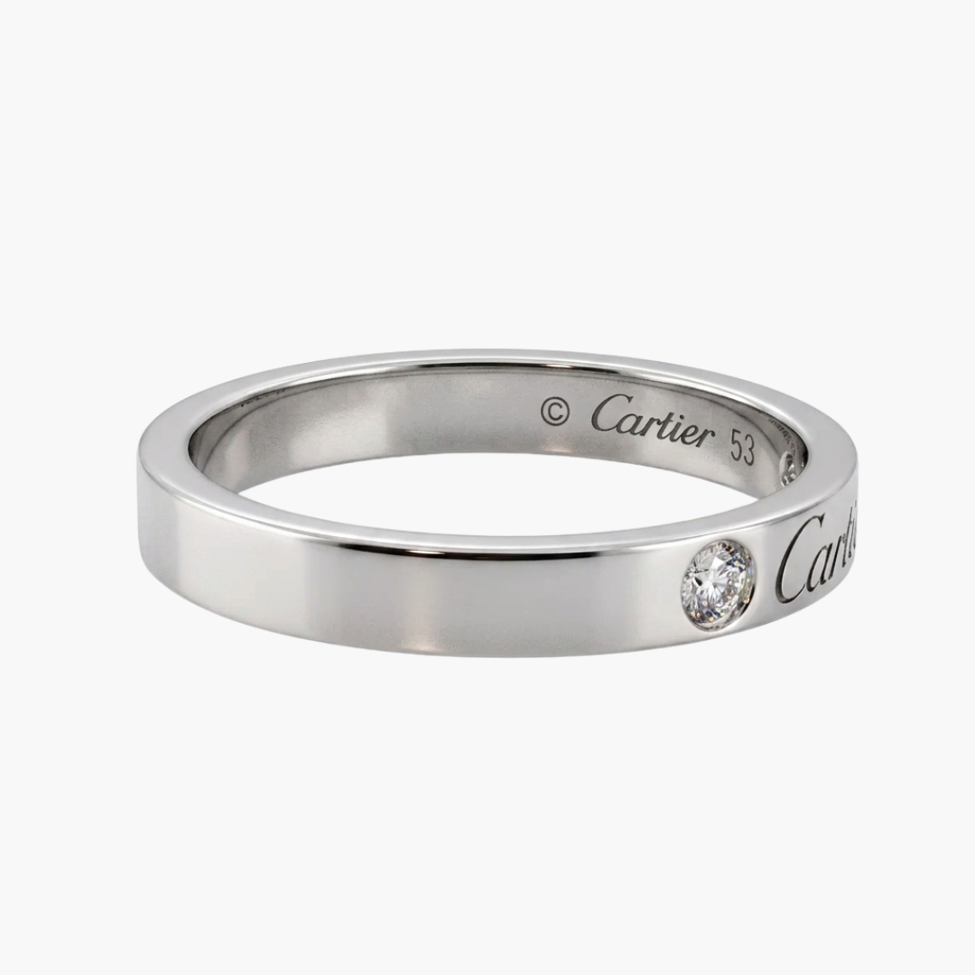 Comprar alianza de la prestigiosa firma Cartier realizada en platino y con dos diamantes talla brillante engastados. Cartier de segunda mano. Joyería Ian'Or.