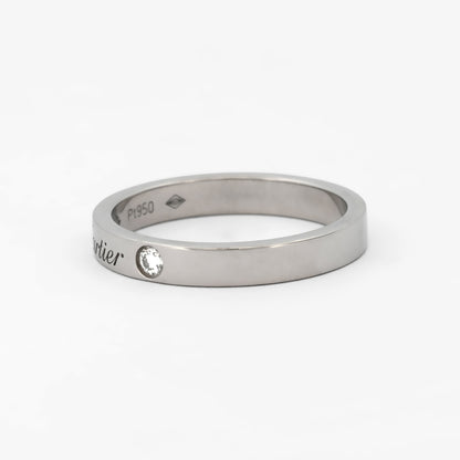 Comprar alianza de la prestigiosa firma Cartier realizada en platino y con dos diamantes talla brillante engastados. Cartier de segunda mano. Joyería Ian'Or.