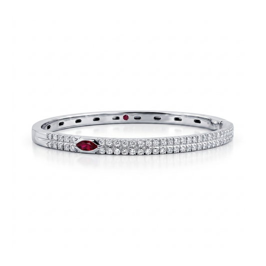 Comprar pulsera esclava realizada en oro blanco de 18kt. Con carril de 58 diamantes talla brillante y dos rubíes. Joyería Ian'Or. Envío gratis.