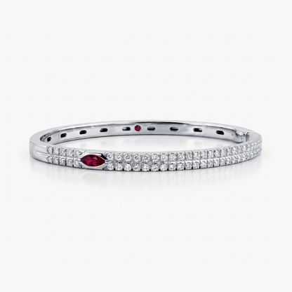 Comprar pulsera esclava realizada en oro blanco de 18kt. Con carril de 58 diamantes talla brillante y dos rubíes. Joyería Ian'Or. Envío gratis.