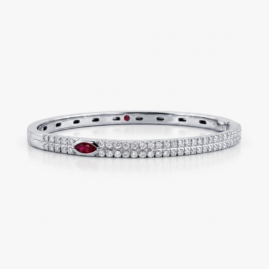 Comprar pulsera esclava realizada en oro blanco de 18kt. Con carril de 58 diamantes talla brillante y dos rubíes. Joyería Ian'Or. Envío gratis.