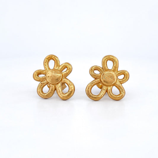 Comprar pendientes realizados en oro amarillo de 18kt con textura, de la firma TOUS en forma de flor irregular. Joyas Tous acondicionadas. Joyería Ian'Or.