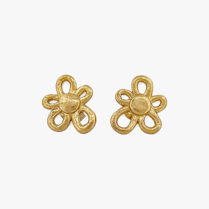 Comprar pendientes realizados en oro amarillo de 18kt con textura, de la firma TOUS en forma de flor irregular. Joyas Tous acondicionadas. Joyería Ian'Or.