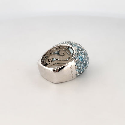 Comprar anillo de la firma Sillam realizado en oro blanco de 18kt con aguamarina central y talla brillante alrededor y en los brazos del anillo. Envío GRATIS.

