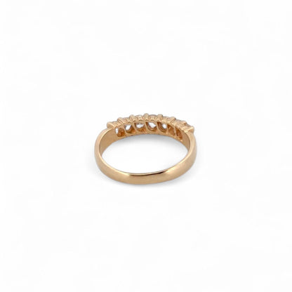 Comprar media alianza de oro amarillo de 18kt con 7 brillantes engastados en grapas. Joyas de segunda mano. Envío GRATIS. Anillos de compromiso baratos.
