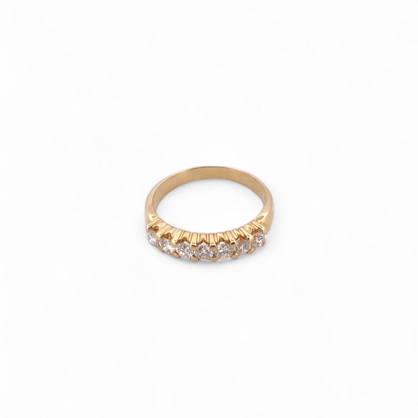 Comprar media alianza de oro amarillo de 18kt con 7 brillantes engastados en grapas. Joyas de segunda mano. Envío GRATIS. Anillos de compromiso baratos.
